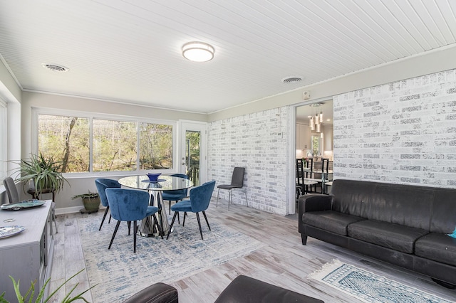 sunroom / solarium featuring visible vents