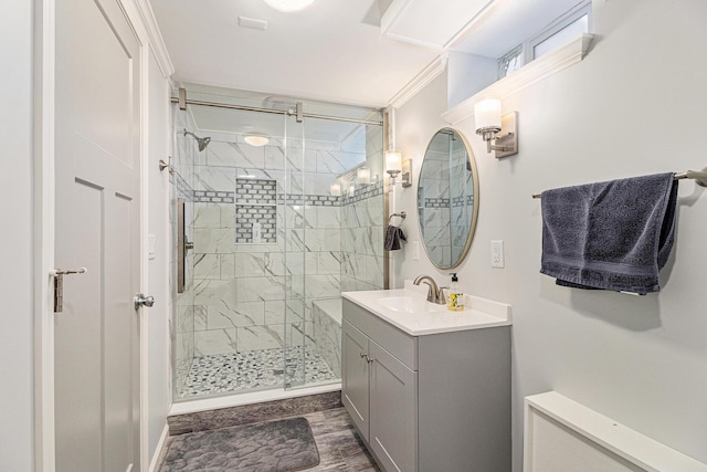 bathroom featuring a shower stall and vanity