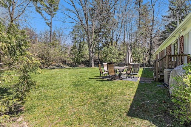 view of yard featuring a patio area and cooling unit