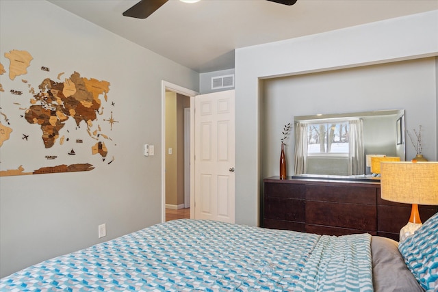 bedroom with ceiling fan and visible vents