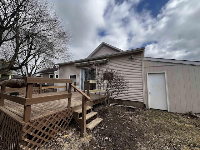 back of house with a wooden deck