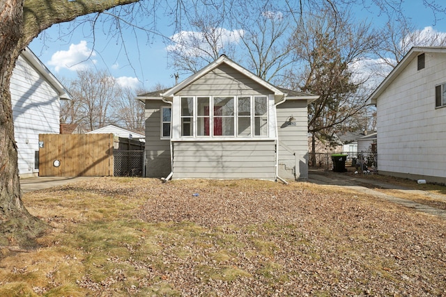 view of front of property featuring fence