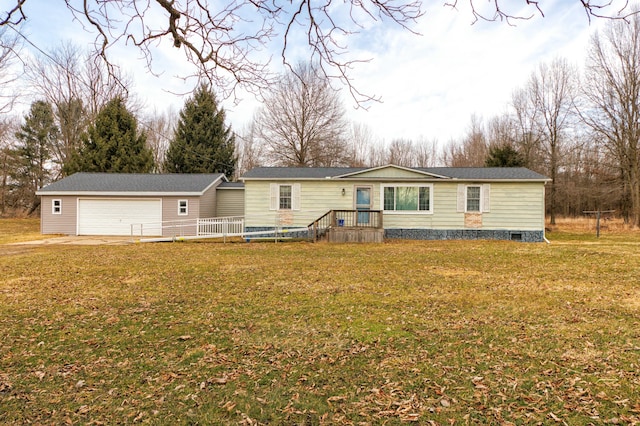 manufactured / mobile home featuring an attached garage, crawl space, an outdoor structure, and a front yard