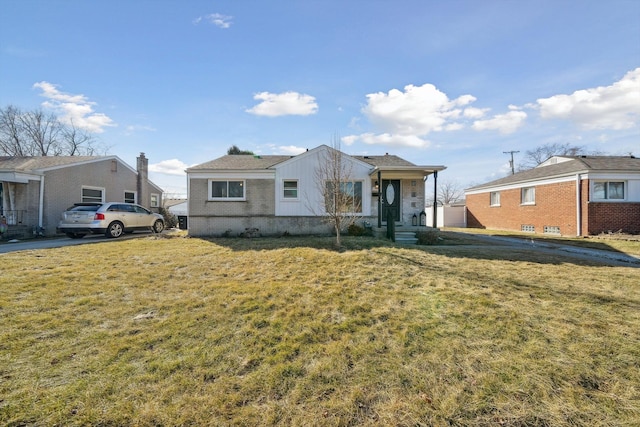 view of front of property with brick siding, board and batten siding, and a front yard