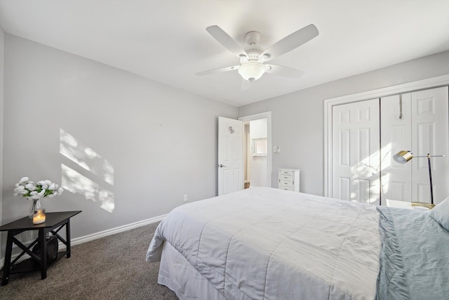 carpeted bedroom featuring ceiling fan, a closet, and baseboards