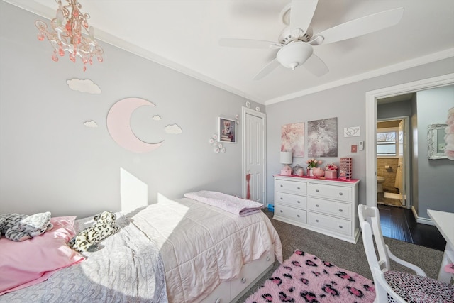 bedroom featuring ornamental molding, dark carpet, baseboards, and a ceiling fan