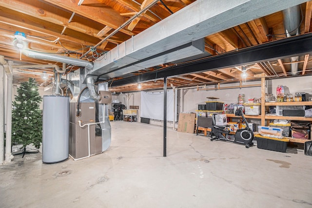 unfinished basement featuring heating unit and gas water heater