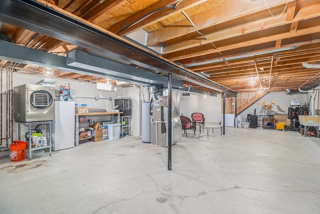 unfinished basement with water heater, washer / clothes dryer, and heating unit