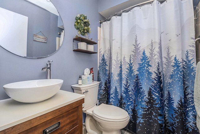 bathroom with vanity, toilet, and a shower with curtain