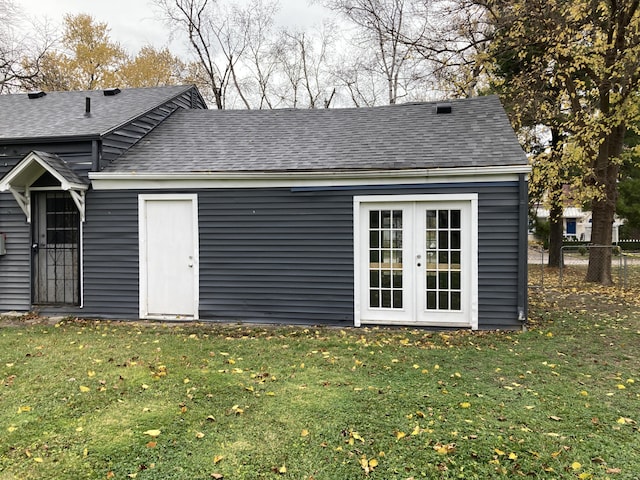 view of outbuilding featuring fence