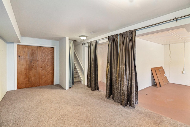 interior space featuring light carpet and stairs