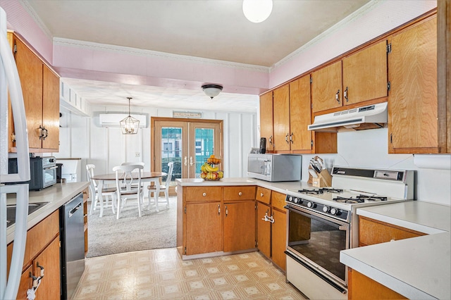 kitchen featuring appliances with stainless steel finishes, light floors, light countertops, french doors, and under cabinet range hood