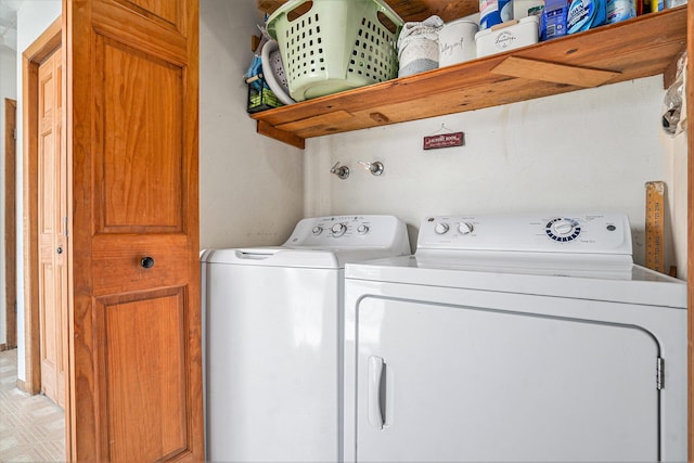 laundry room with laundry area, light floors, and washing machine and clothes dryer