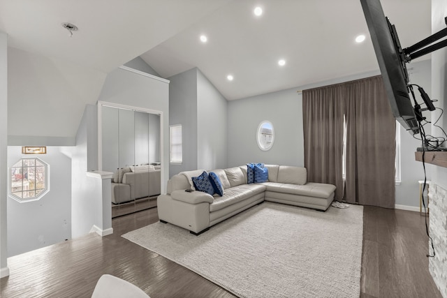 living room with lofted ceiling, baseboards, recessed lighting, and wood finished floors