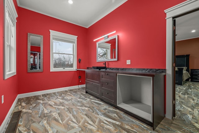 bathroom with ornamental molding, recessed lighting, vanity, and baseboards