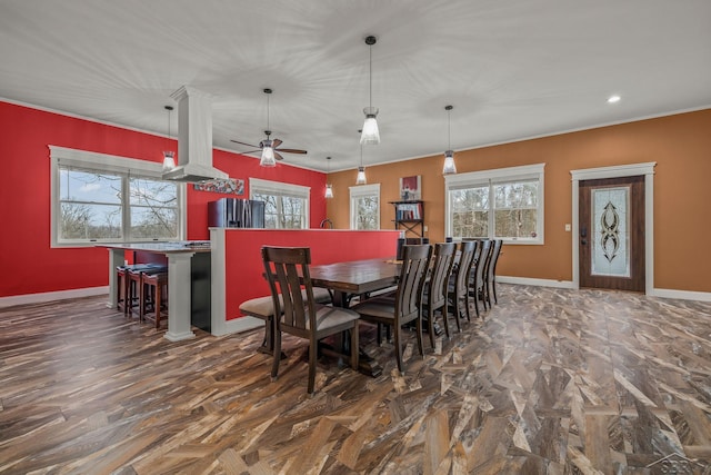 dining space with ornamental molding, recessed lighting, baseboards, and a ceiling fan