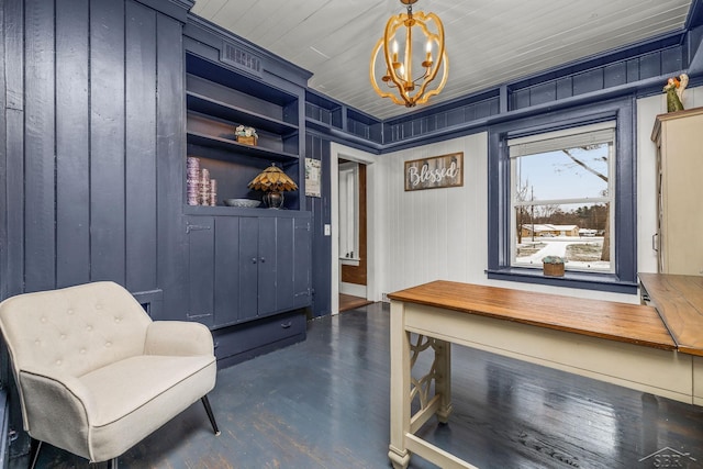 home office featuring built in shelves, a notable chandelier, dark wood finished floors, wooden walls, and wooden ceiling