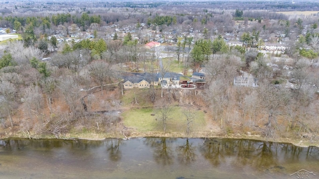 aerial view featuring a water view and a view of trees