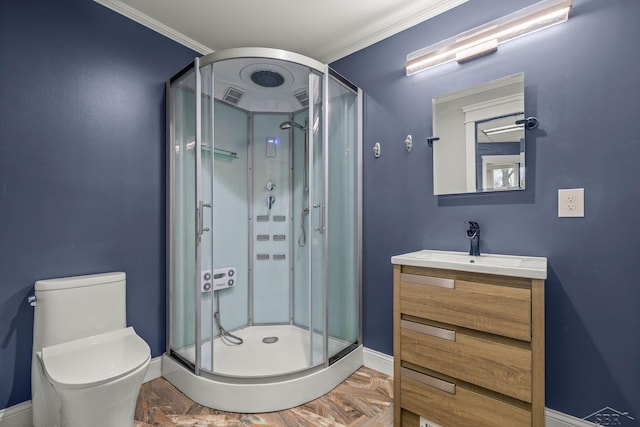 bathroom with baseboards, toilet, ornamental molding, vanity, and a shower stall