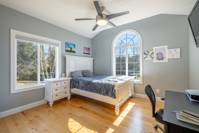 bedroom with vaulted ceiling, a ceiling fan, baseboards, and light wood finished floors