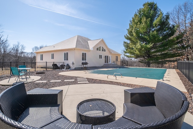 view of swimming pool with a patio area, central air condition unit, a fenced backyard, and a fenced in pool