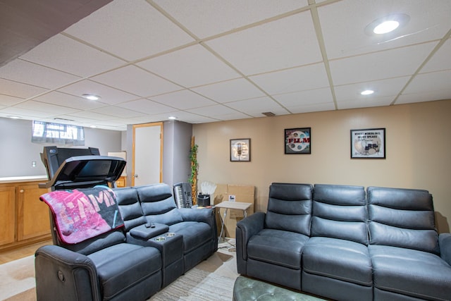 living room featuring a paneled ceiling and recessed lighting