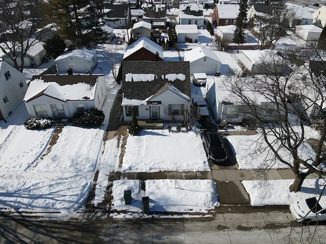 snowy aerial view featuring a residential view