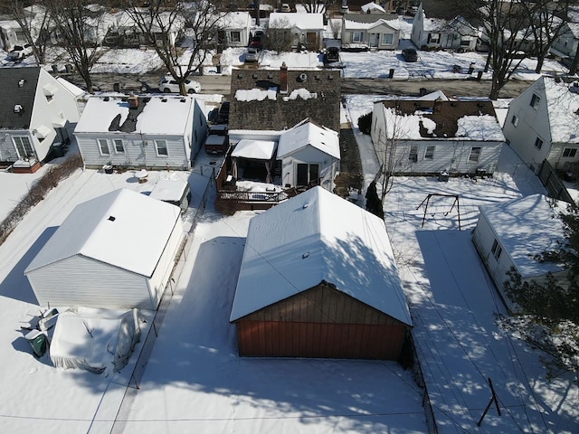 snowy aerial view featuring a residential view