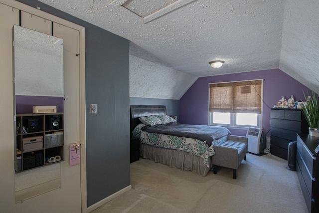 bedroom with carpet, vaulted ceiling, and a textured ceiling