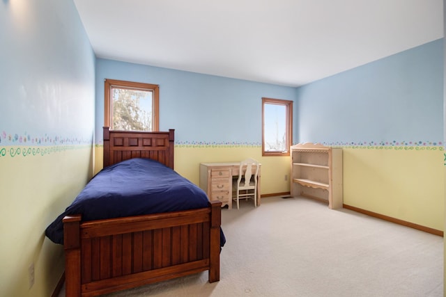 carpeted bedroom with baseboards