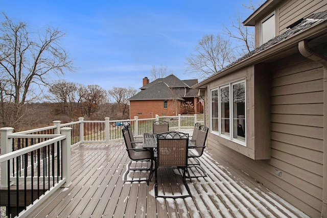 wooden terrace with outdoor dining area