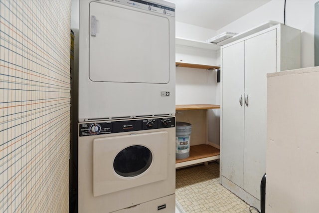 laundry area featuring laundry area and stacked washer / drying machine