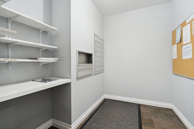 interior space with dark colored carpet