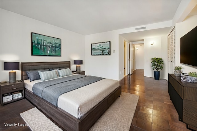 bedroom featuring visible vents