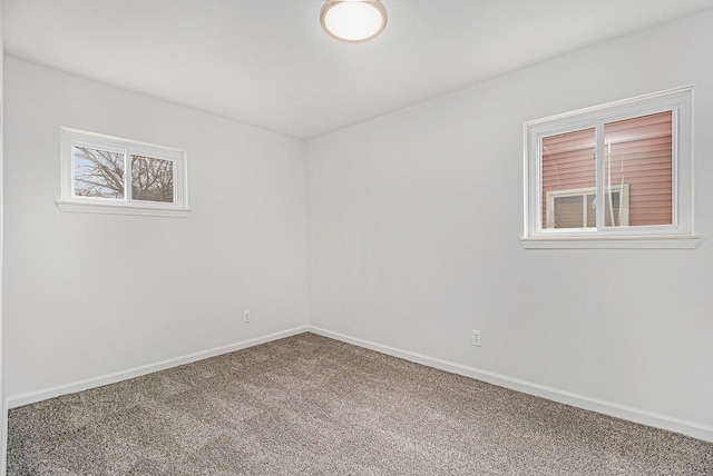 spare room with carpet flooring and baseboards