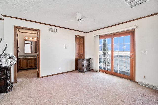 interior space with access to outside, visible vents, and a textured ceiling
