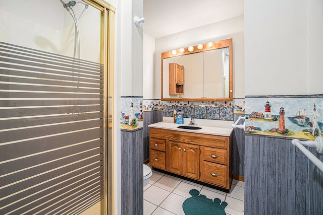 full bath with tile patterned flooring, a shower stall, vanity, and toilet