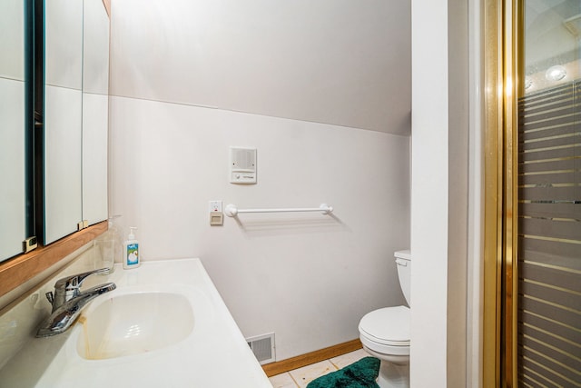 half bathroom featuring visible vents, toilet, baseboards, tile patterned flooring, and lofted ceiling