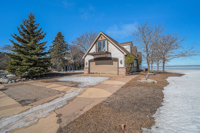 view of front of house with a water view