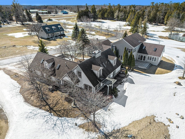 snowy aerial view featuring a residential view