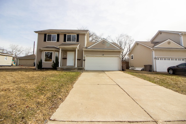 traditional home featuring a garage and concrete driveway