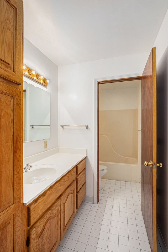 bathroom with a shower, toilet, tile patterned floors, a washtub, and vanity