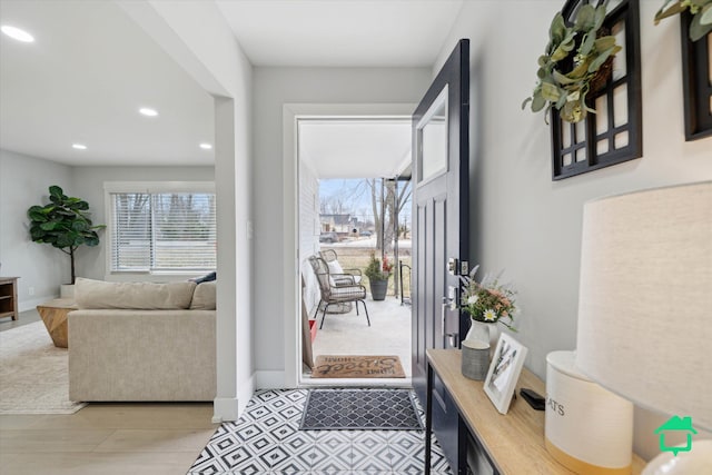 entrance foyer featuring recessed lighting and baseboards