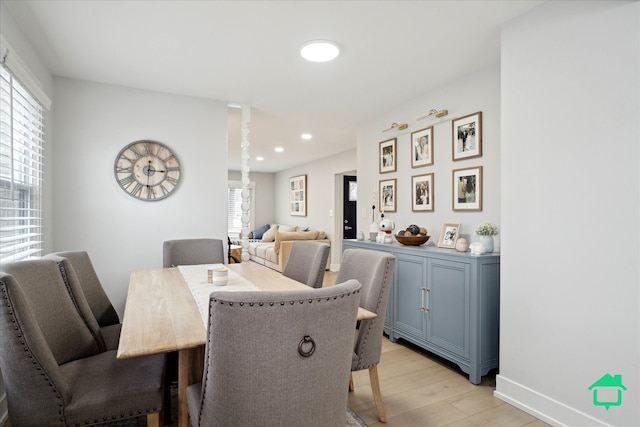 dining room featuring light wood-style floors, recessed lighting, and baseboards