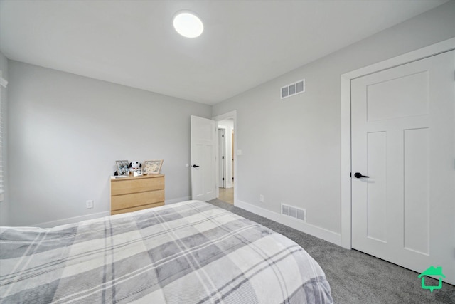 bedroom featuring carpet floors, visible vents, and baseboards