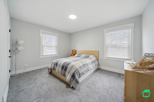 carpeted bedroom with baseboards