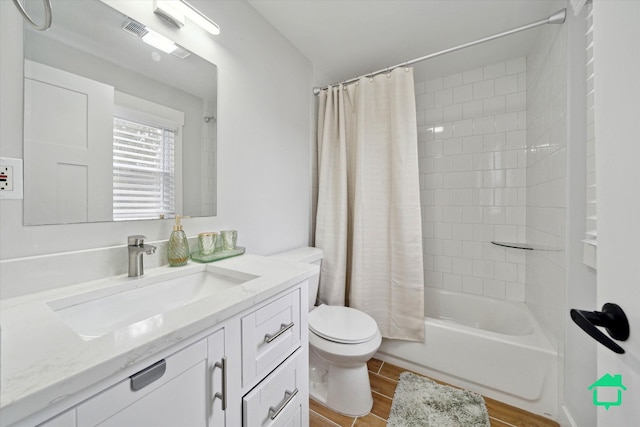 full bathroom with vanity, wood finished floors, shower / bath combination with curtain, and toilet