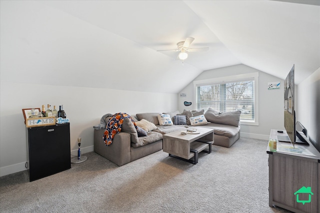 living area featuring lofted ceiling, carpet floors, ceiling fan, and baseboards