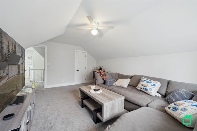 carpeted living area with ceiling fan, baseboards, and vaulted ceiling