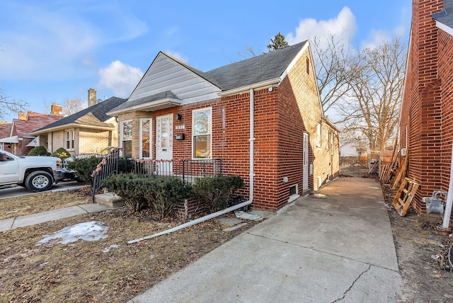 view of front of home with brick siding